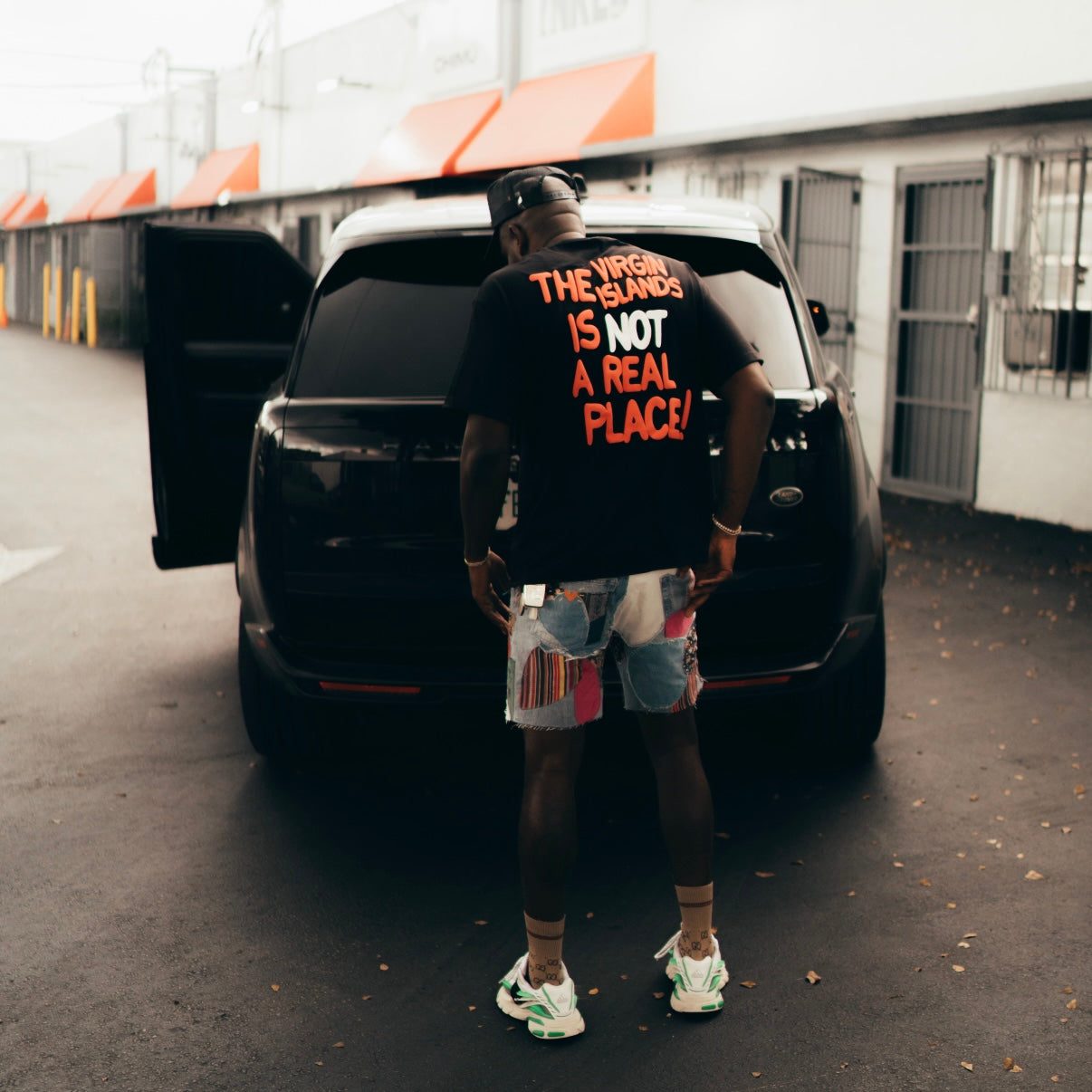 Unisex Black | Red The VI is Not a Real Place Puff Tee